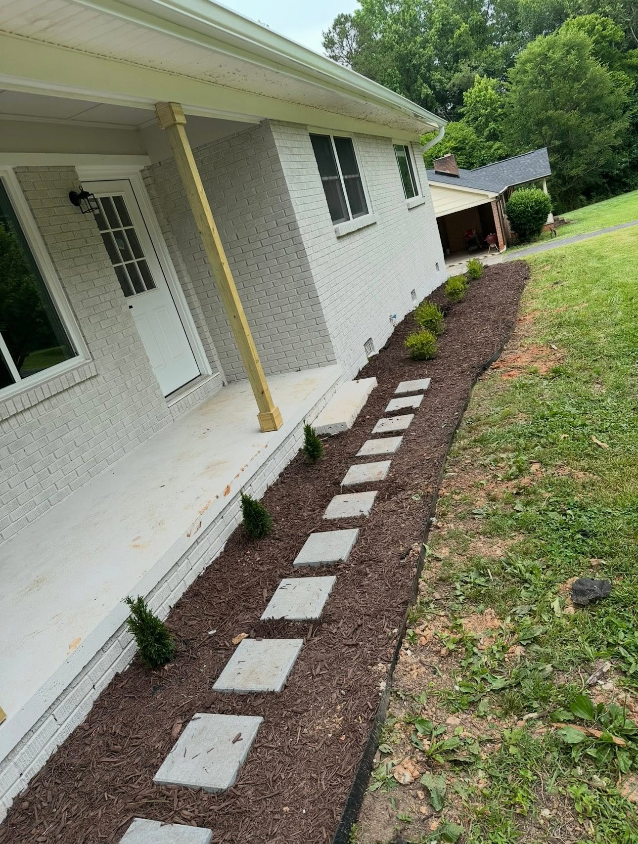 New mulch bed with stepping-stone path