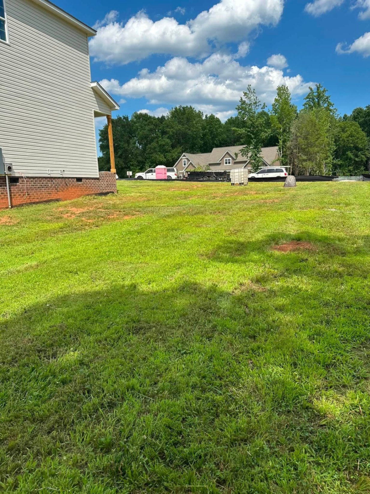Freshly cut side yard at a new-construction home